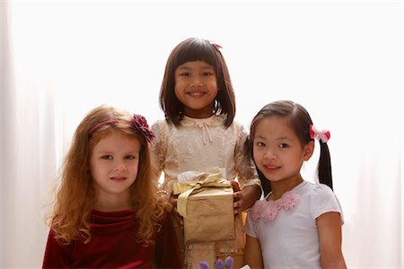 three young girls smiling together Stock Photo - Premium Royalty-Free, Code: 656-04926569