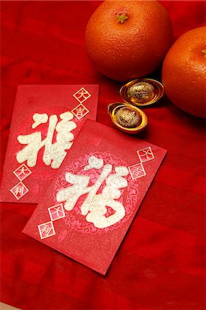 red envelope (Hong Bao), oranges and gold ingot Foto de stock - Sin royalties Premium, Código: 656-04926620