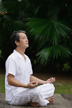 simsearch:656-01765715,k - Mature man sitting outdoors practicing Yoga Stock Photo - Premium Royalty-Free, Code: 656-01765231