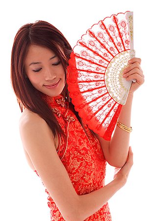 simsearch:656-01765511,k - Young woman wearing cheongsam and holding traditional Chinese fan Stock Photo - Premium Royalty-Free, Code: 656-01765523