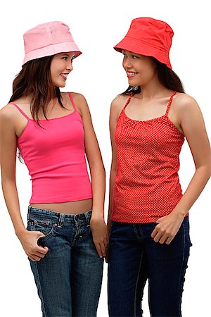 simsearch:656-01765511,k - two young women wearing red and pink, looking at each other Stock Photo - Premium Royalty-Free, Code: 656-01765736