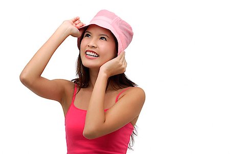 simsearch:656-01765511,k - Young woman wearing pink hat and smiling Stock Photo - Premium Royalty-Free, Code: 656-01765739