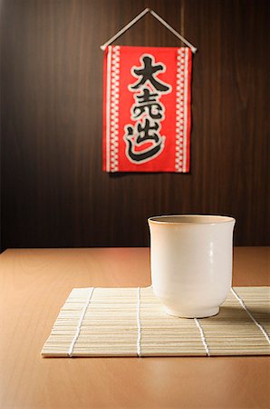 food on mat - tea and "for sale" sign Stock Photo - Premium Royalty-Free, Code: 656-01765821