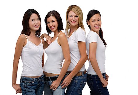 simsearch:656-01765786,k - Quatre jeunes femmes portant des chemises blanches et jeans, souriant à la caméra Photographie de stock - Premium Libres de Droits, Code: 656-01765845