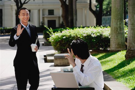 simsearch:656-01766020,k - Two men wave at each other in the park Foto de stock - Sin royalties Premium, Código: 656-01766056