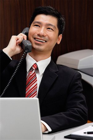 A businessman on the telephone Stock Photo - Premium Royalty-Free, Code: 656-01766230
