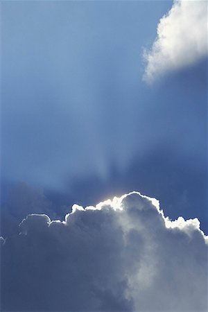 sky sun rays dramatic - The sun shining from behind clouds Stock Photo - Premium Royalty-Free, Code: 656-01766426