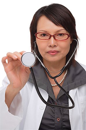 simsearch:656-01766955,k - Doctor holding up stethoscope and looking at camera Foto de stock - Sin royalties Premium, Código: 656-01766805
