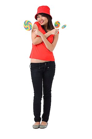 simsearch:640-02951833,k - Young woman with lollipop smiling at camera Foto de stock - Royalty Free Premium, Número: 656-01766833