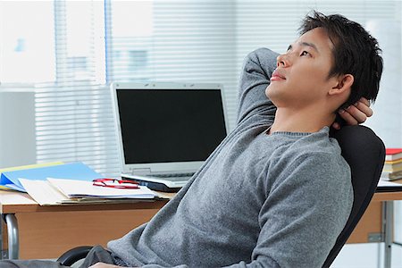 Man leaning back in office chair Stock Photo - Premium Royalty-Free, Code: 656-01766848