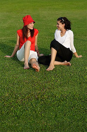 simsearch:656-01765624,k - Young women in park, looking at each other Stock Photo - Premium Royalty-Free, Code: 656-01766910