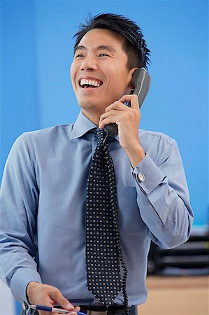 simsearch:656-01766118,k - Businessman laughing while on the phone Foto de stock - Royalty Free Premium, Número: 656-01767056