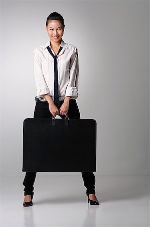 slacks women - Young woman with portfolio Stock Photo - Premium Royalty-Free, Code: 656-01767092