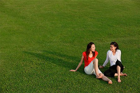 simsearch:656-01765624,k - Two women relaxing in the park Stock Photo - Premium Royalty-Free, Code: 656-01767141