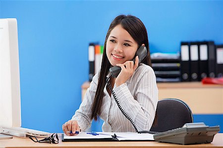 Businesswoman talking on the phone Stock Photo - Premium Royalty-Free, Code: 656-01767151