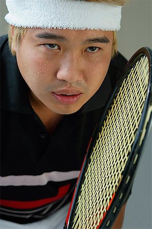 sweaty asian men - Man playing tennis Stock Photo - Premium Royalty-Free, Code: 656-01767199