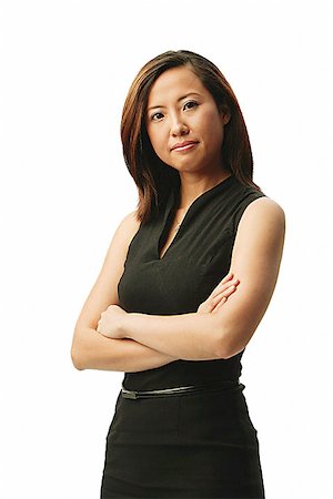 singapore women 30s - Woman looking at camera, arms crossed, portrait Stock Photo - Premium Royalty-Free, Code: 656-01767350