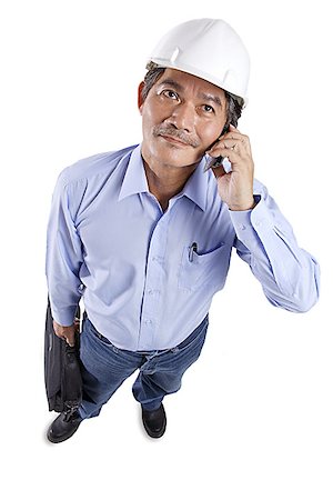 simsearch:656-03519571,k - Mature man wearing construction hat, using mobile phone Foto de stock - Sin royalties Premium, Código: 656-01767583