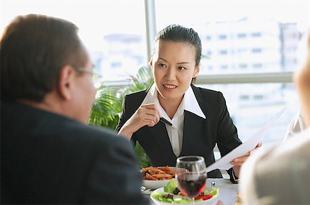 singapore women 30s - Executives having a working lunch Stock Photo - Premium Royalty-Free, Code: 656-01767704