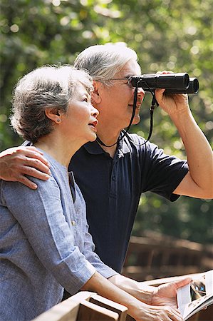 simsearch:656-01768177,k - Senior couple side by side, man using binoculars Stock Photo - Premium Royalty-Free, Code: 656-01767734