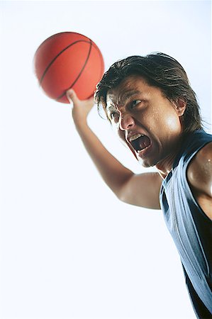 simsearch:656-03241028,k - Man holding basketball in the air mouth open Foto de stock - Sin royalties Premium, Código: 656-01767981