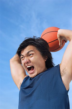 simsearch:656-01765624,k - Man holding basketball, shouting Stock Photo - Premium Royalty-Free, Code: 656-01767990