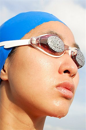singapore women 30s - Woman wearing swimming goggles, head shot Stock Photo - Premium Royalty-Free, Code: 656-01768186