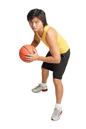simsearch:656-01767934,k - Man holding basketball, preparing to shoot Foto de stock - Sin royalties Premium, Código: 656-01768194