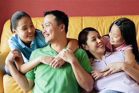 simsearch:656-01768177,k - Family of four smiling at each other Stock Photo - Premium Royalty-Free, Code: 656-01768292