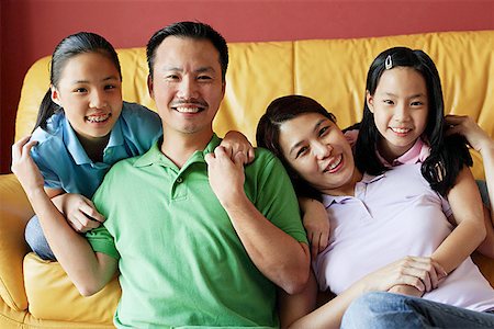 family condo - Family of four smiling at camera Stock Photo - Premium Royalty-Free, Code: 656-01768293