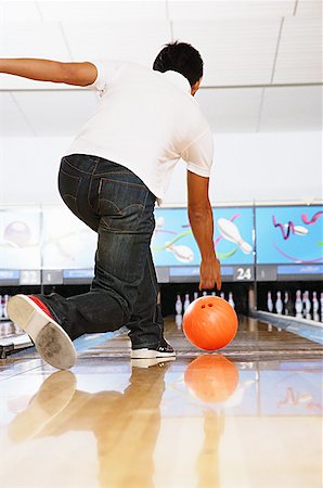 Man in bowling alley, rear view Stock Photo - Premium Royalty-Free, Code: 656-01768667