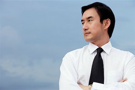 simsearch:694-03330980,k - Businessman with arms crossed, looking to the side Stock Photo - Premium Royalty-Free, Code: 656-01768794