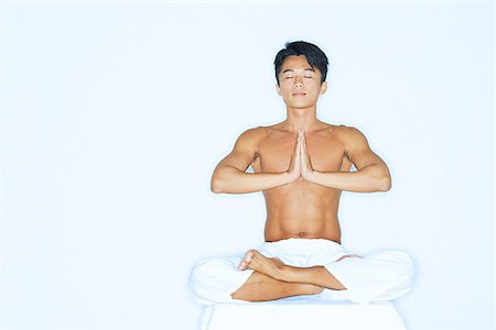 simsearch:656-01765715,k - Man practicing yoga, meditating Stock Photo - Premium Royalty-Free, Code: 656-01769177