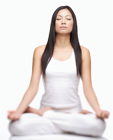 simsearch:656-01765715,k - Woman practicing yoga, sitting in lotus position Stock Photo - Premium Royalty-Free, Code: 656-01769170