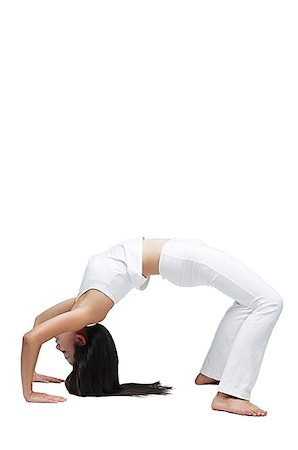 posición de rueda - Woman doing yoga, bending over backwards Foto de stock - Sin royalties Premium, Código: 656-01769218