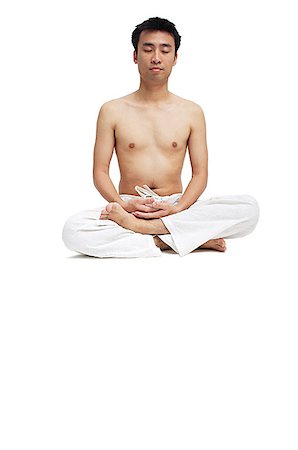 Man sitting in lotus position Stock Photo - Premium Royalty-Free, Code: 656-01769455