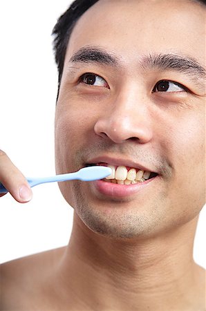 Man brushing teeth Stock Photo - Premium Royalty-Free, Code: 656-01769450