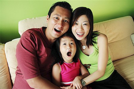 simsearch:656-01768177,k - Family with one child, smiling at camera Stock Photo - Premium Royalty-Free, Code: 656-01769510