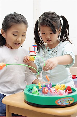 simsearch:656-01773586,k - Two girls playing with fishing game Stock Photo - Premium Royalty-Free, Code: 656-01770502
