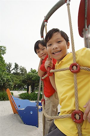 simsearch:656-01773586,k - Two boys in playground, looking at camera Stock Photo - Premium Royalty-Free, Code: 656-01770593