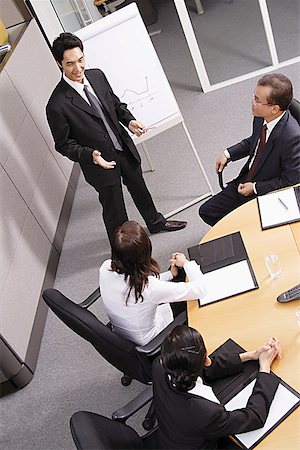 simsearch:656-01767698,k - Group having a business meeting Foto de stock - Royalty Free Premium, Número: 656-01770750