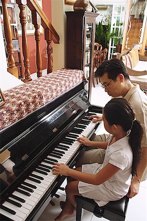 father daughter school - Father and daughter playing piano Stock Photo - Premium Royalty-Free, Code: 656-01770921