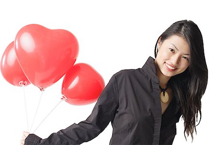 simsearch:656-01770941,k - Woman holding three red balloons, portrait Foto de stock - Sin royalties Premium, Código: 656-01770961