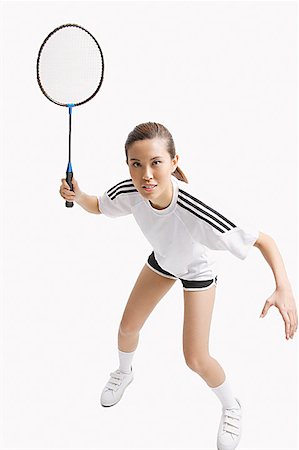 Young woman holding badminton racket Stock Photo - Premium Royalty-Free, Code: 656-01771286