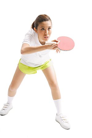 paddle - Jeune femme avec une raquette de tennis de table, studio shot Photographie de stock - Premium Libres de Droits, Code: 656-01771291