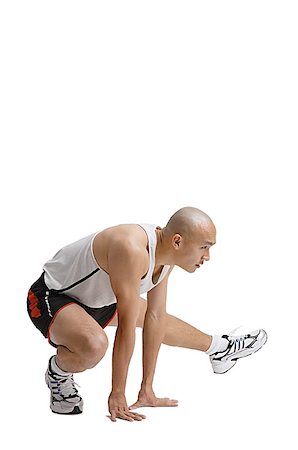 simsearch:656-01769580,k - Young man doing stretching exercise Foto de stock - Sin royalties Premium, Código: 656-01771368
