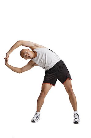 simsearch:656-01767955,k - Young man doing stretching exercise Foto de stock - Sin royalties Premium, Código: 656-01771369