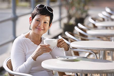 restaurant portrait asian - Mature woman in cafe having a drink Stock Photo - Premium Royalty-Free, Code: 656-01771570