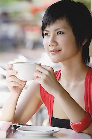 Woman having cup of coffee, looking away Stock Photo - Premium Royalty-Free, Code: 656-01771598