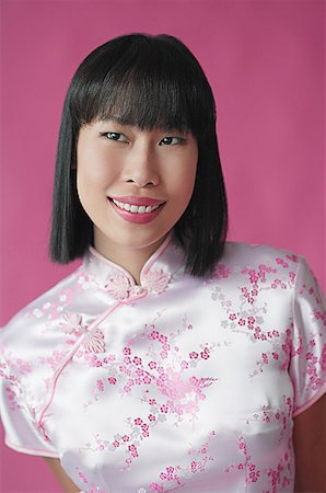 Woman in cheongsam, portrait Stock Photo - Premium Royalty-Free, Code: 656-01771915